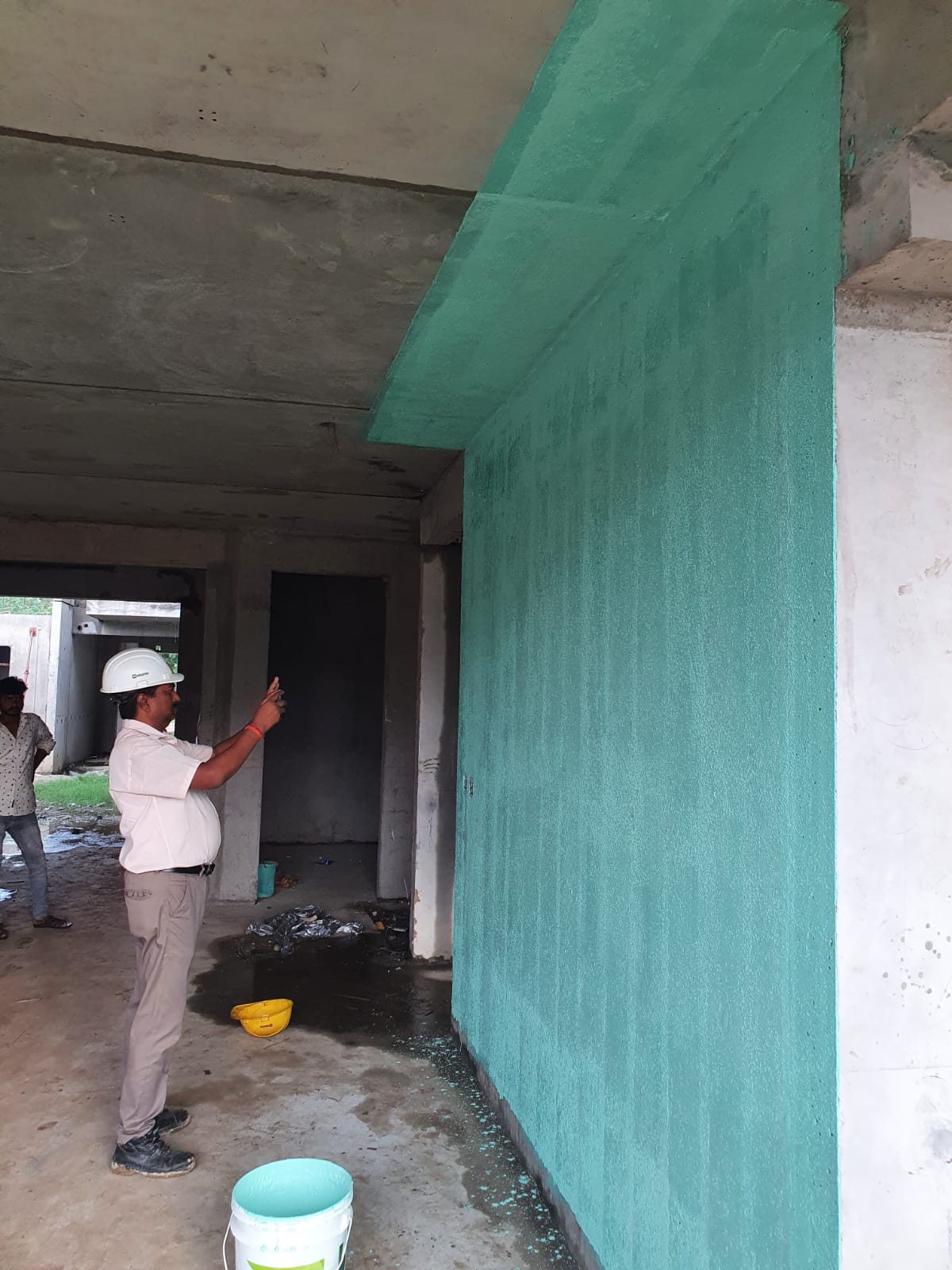Site Engineer Inspecting Green Bonding Coat